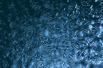 Abstract blue metallic starburst texture